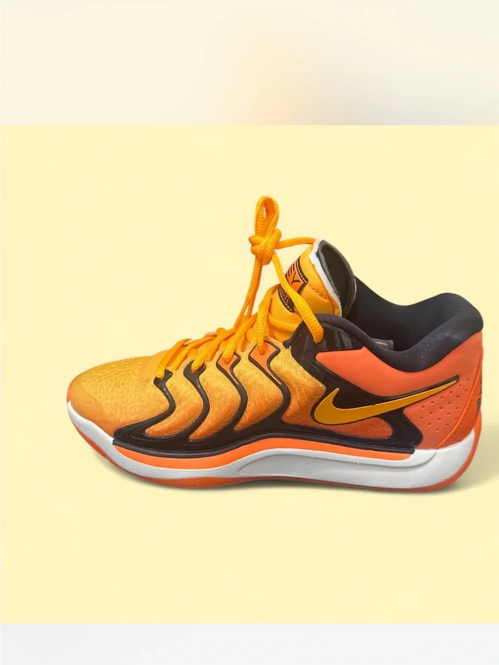 Nike Orange and Black Basketball Shoe with Yellow Swoosh. unisex shoes